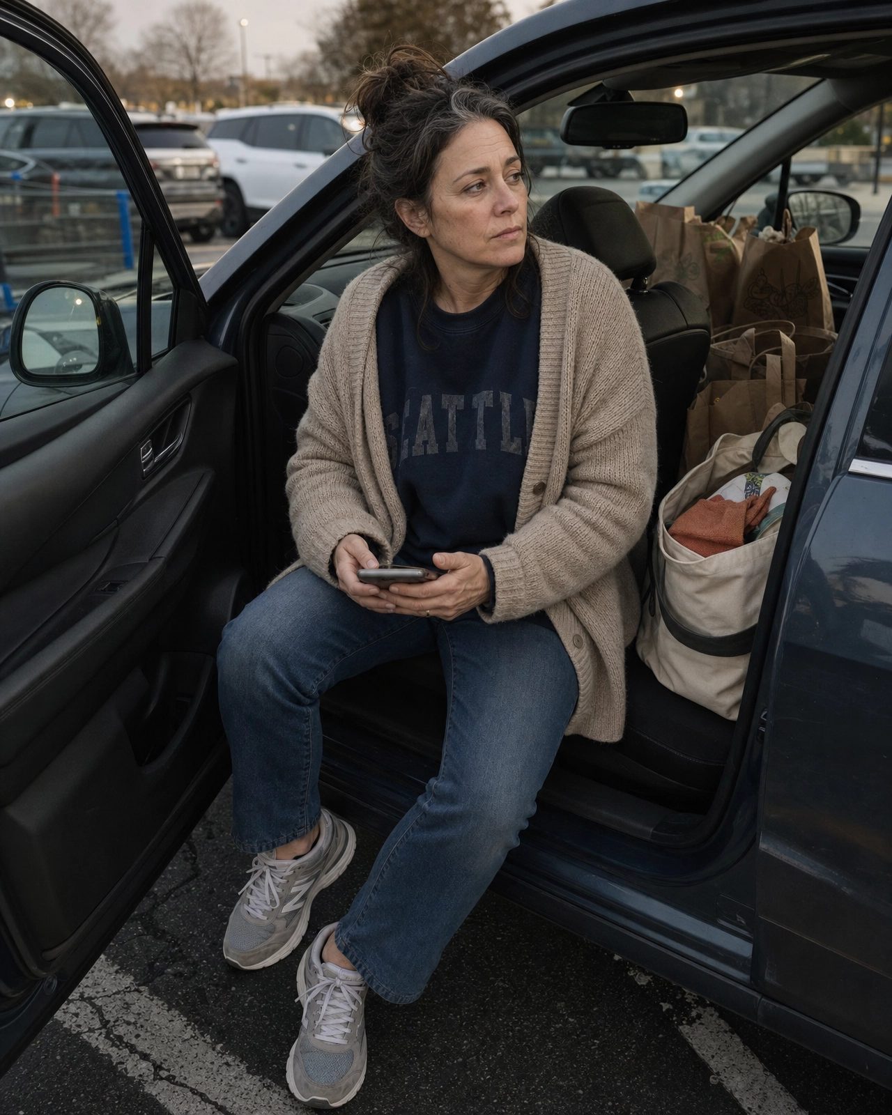 A Gen X woman in the grocery store parking lot at the end of a long day — tired, grounded, real
